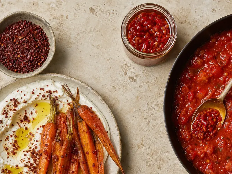 Aleppo flakes finishing labneh and carrots beside Calabrian chile stirred into tomato sauce