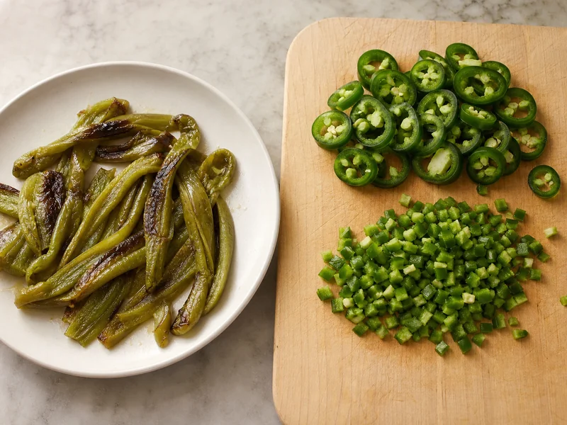 Roasted Anaheim strips and fresh sliced Jalapeño prepared for different dishes