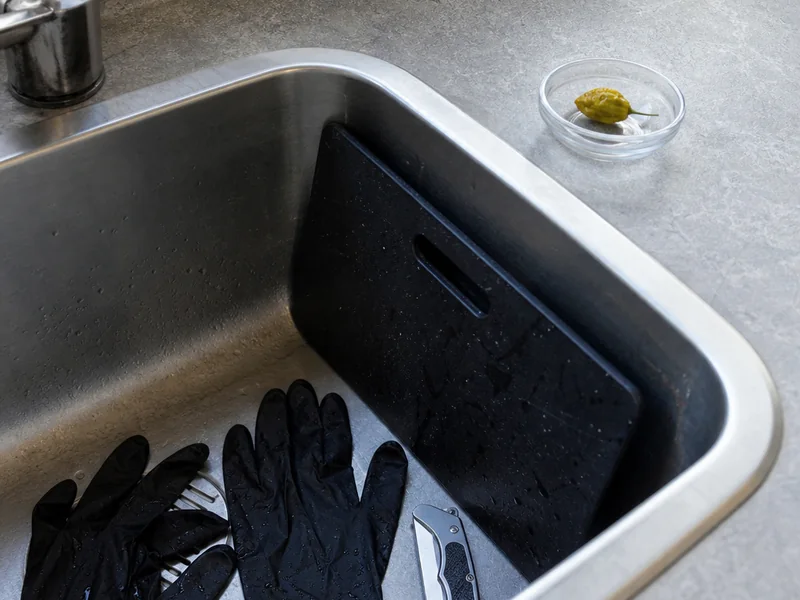 Gloves and tools separated for cleanup after handling a superhot pepper