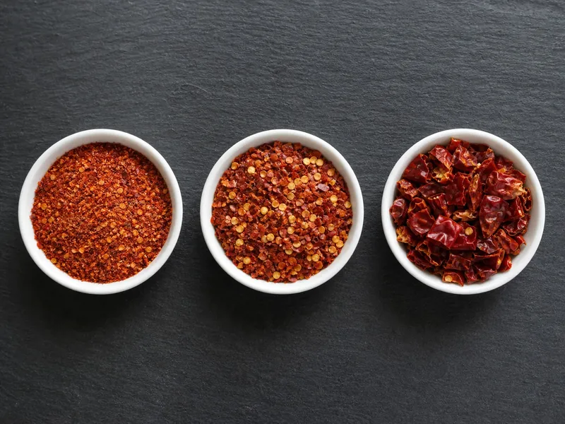 Three bowls showing fine, standard, and coarse crushed red pepper textures