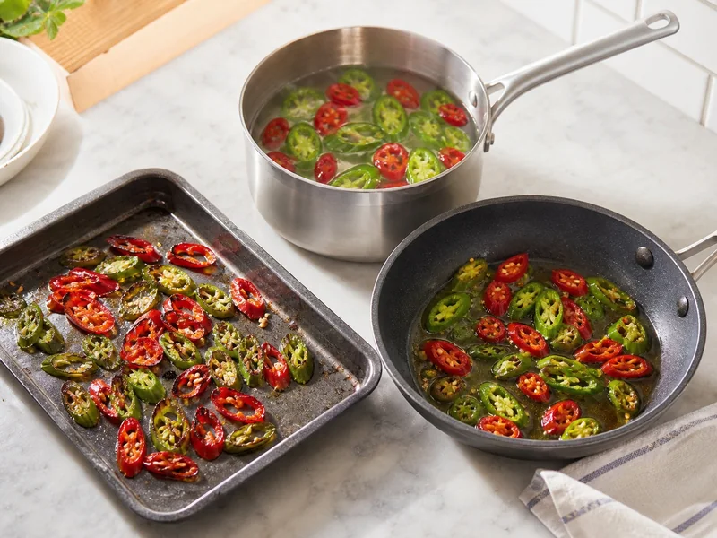 Equal chile slices roasted, simmered in water, and bloomed in oil