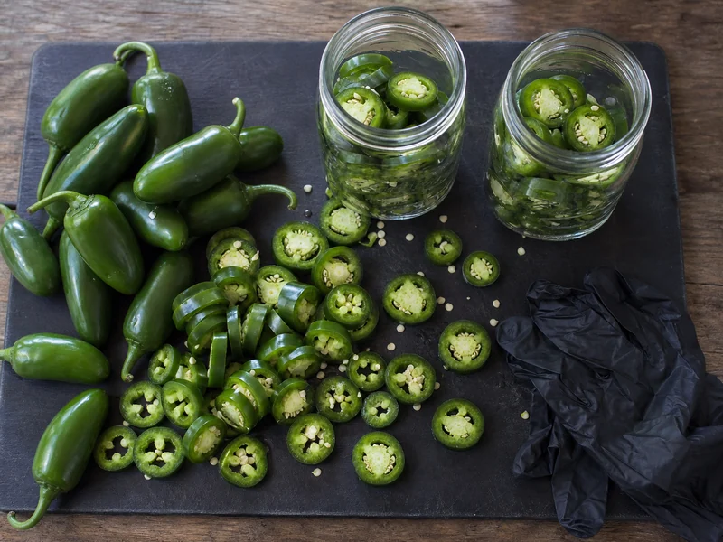 Fresh jalapenos cut into quarter-inch rings and packed into two clean pint jars
