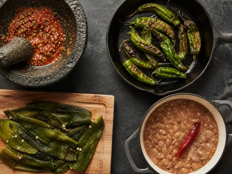 Fresh chili peppers prepared raw, blistered, roasted, and simmered in four dishes