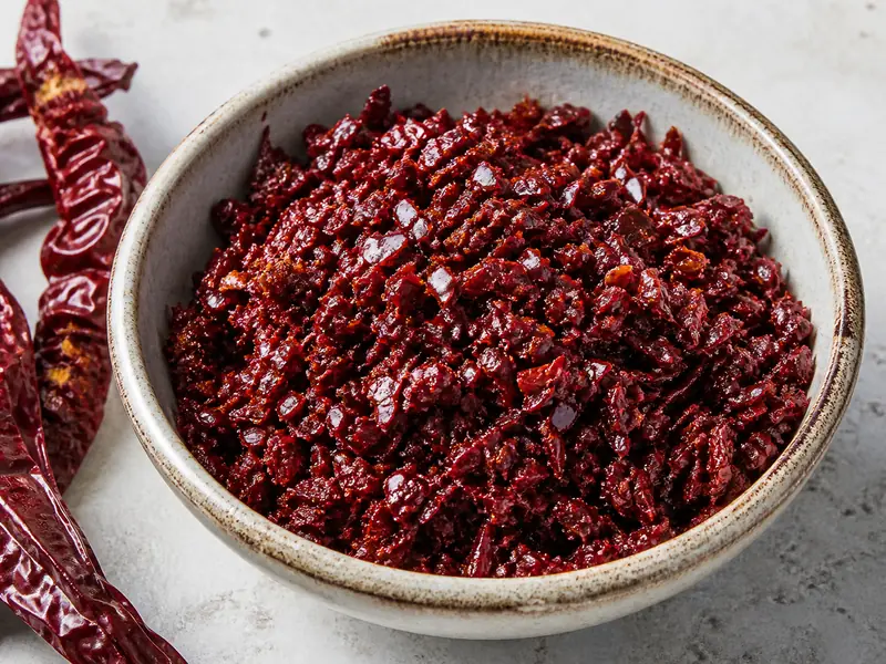 Coarse deep-red Aleppo pepper flakes with a soft, lightly oiled texture