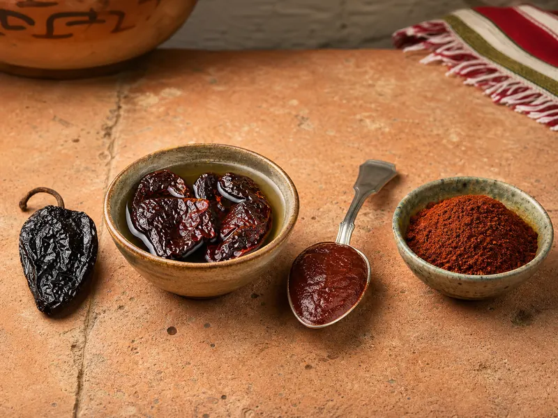 Whole, soaked, pureed, and powdered morita chile forms