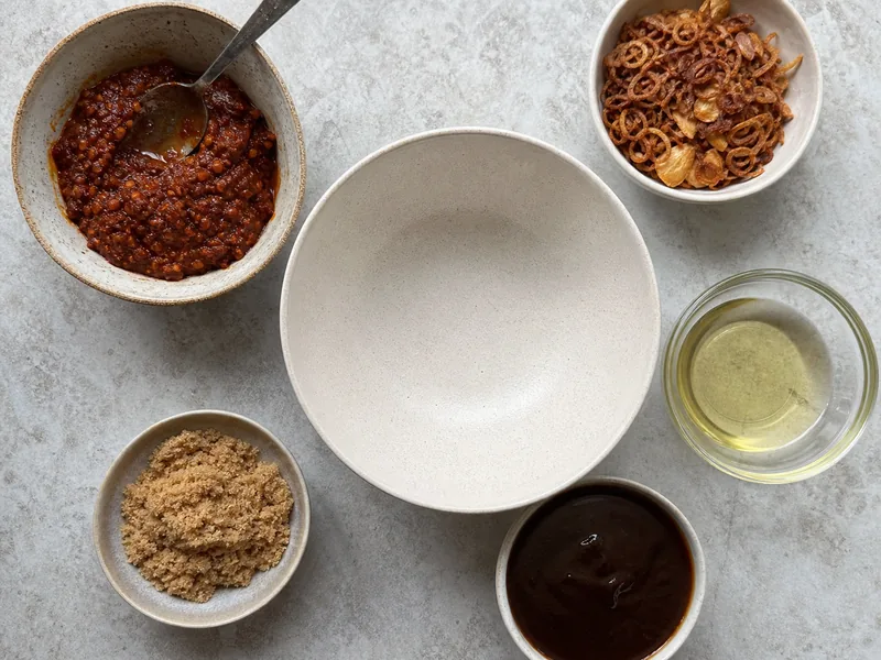 Sambal, fried shallot, garlic, brown sugar, tamarind, and oil for a quick substitute
