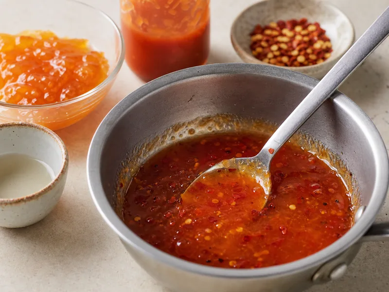 Sweet chili sauce substitutes including jam, honey, chili garlic sauce, pepper jelly, and vinegar